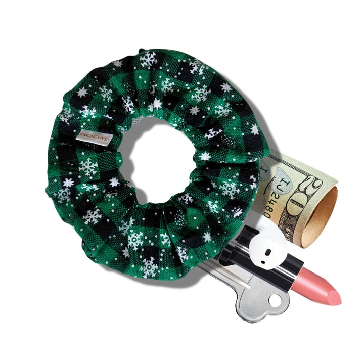 Cotton green holiday scrunchie with snowflakes and hidden zipper pocket for valuables (cash, keys, AirPods), featuring strong elastic for a secure hold. Inspired by the Christmas and winter season, perfect for workouts, festivals, and holiday events.