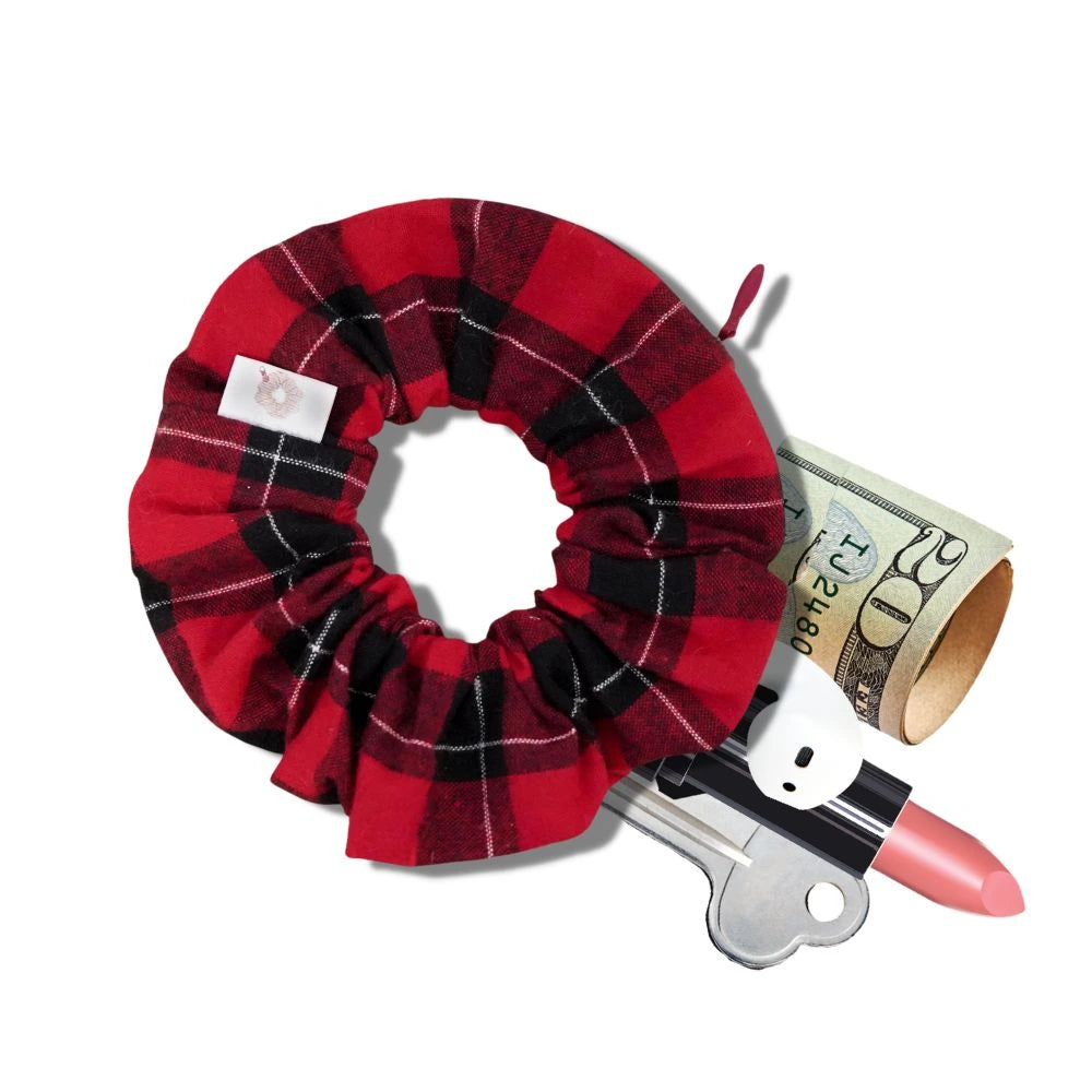 Red flannel holiday scrunchie with a hidden zipper pocket for valuables (cash, keys, AirPods), featuring strong elastic for a secure hold. Inspired by the Christmas season, perfect for workouts, festivals, and holiday events.