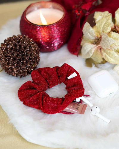 Red sparkly holiday scrunchie with hidden zipper pocket for valuables (cash, keys, AirPods), featuring strong elastic for a secure hold. Inspired by the Christmas season, perfect for workouts, festivals, and holiday events.