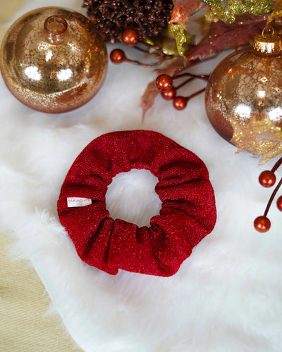 Red sparkly holiday scrunchie with hidden zipper pocket for valuables (cash, keys, AirPods), featuring strong elastic for a secure hold. Inspired by the Christmas season, perfect for workouts, festivals, and holiday events.