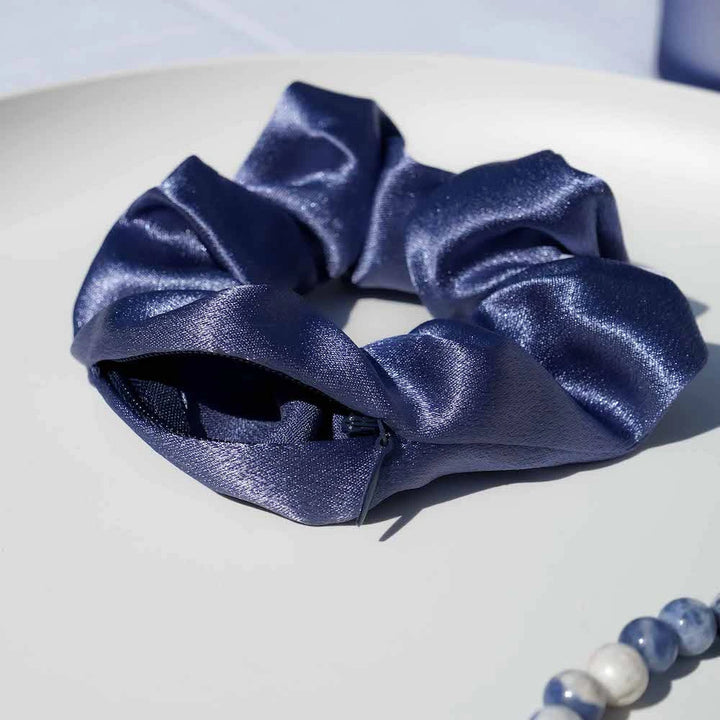 Satin dark blue navy indigo hair scrunchie ponytail holder featuring a hidden zipper pocket for storing valuables (cash, keys, AirPods) and strong elastic for a secure hold. Perfect for workouts, festivals, gifts, and holiday stocking stuffers.