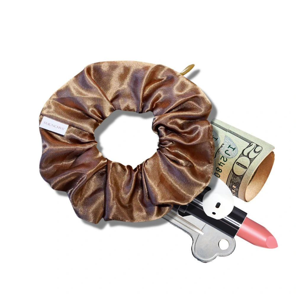 Satin caramel fall scrunchie with a hidden zipper pocket for valuables (cash, keys, AirPods), featuring strong elastic for a secure hold, inspired by the fall season, perfect for workouts and festivals.