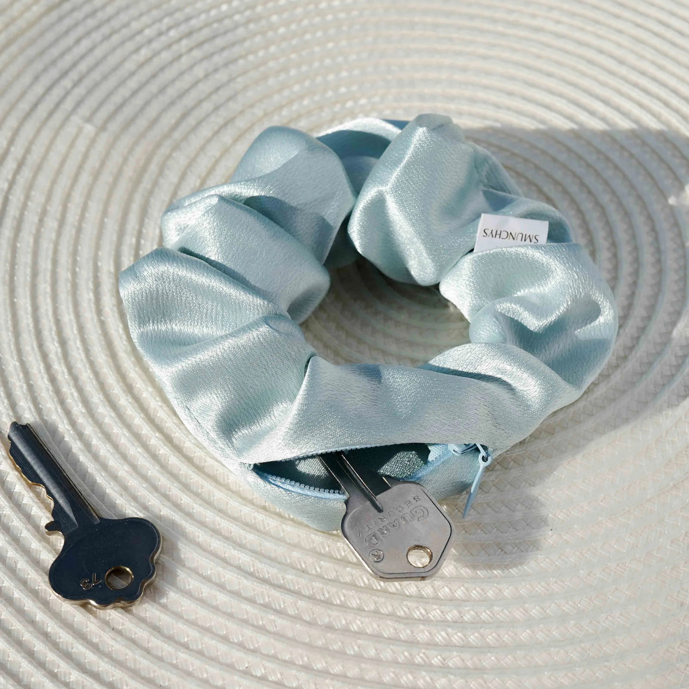 Satin light green and light blue Tiffany blue color hair scrunchie ponytail holder featuring a hidden zipper pocket for storing valuables (cash, keys, AirPods) and strong elastic for a secure hold. Ideal for workouts, festivals, gifts, and holiday stocking stuffers.