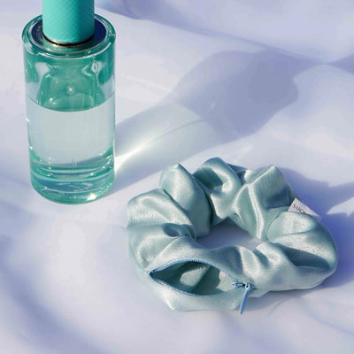 Satin light green and light blue Tiffany blue color hair scrunchie ponytail holder featuring a hidden zipper pocket for storing valuables (cash, keys, AirPods) and strong elastic for a secure hold. Ideal for workouts, festivals, gifts, and holiday stocking stuffers.