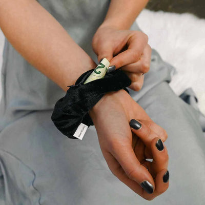 Velvet black hair scrunchie ponytail holder featuring a hidden zipper pocket for storing valuables (cash, keys, AirPods) and strong elastic for a secure hold. Ideal for workouts, festivals, gifts, and holiday stocking stuffers.