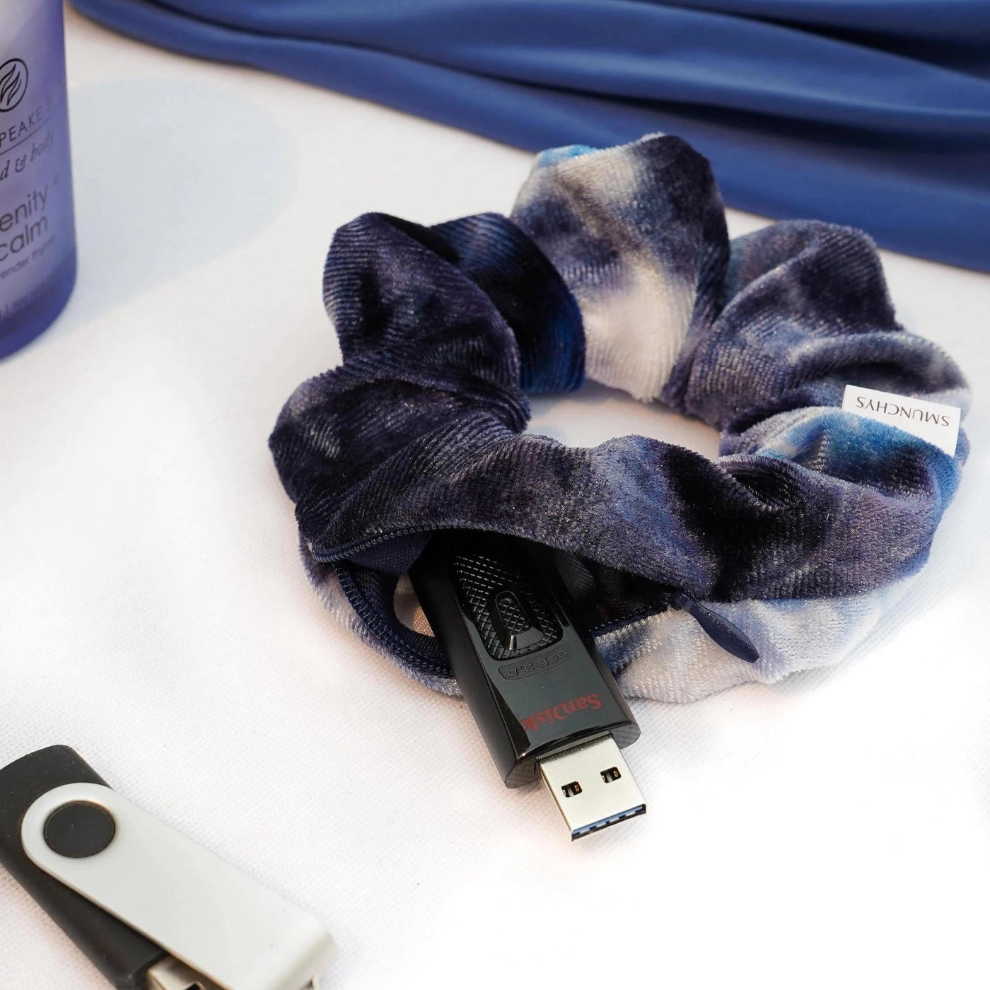 Velvet blue and white tie-dye color hair scrunchie ponytail holder featuring a hidden zipper pocket for storing valuables (cash, keys, AirPods) and strong elastic for a secure hold. Ideal for workouts, festivals, gifts, and holiday stocking stuffers.