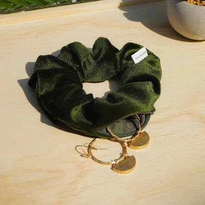 Velvet Olive dark green hair scrunchie ponytail holder featuring a hidden zipper pocket for storing valuables (cash, keys, AirPods) and strong elastic for a secure hold. Perfect for workouts, festivals, gifts, and holiday stocking stuffers.