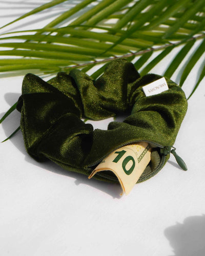 Velvet Olive dark green hair scrunchie ponytail holder featuring a hidden zipper pocket for storing valuables (cash, keys, AirPods) and strong elastic for a secure hold. Perfect for workouts, festivals, gifts, and holiday stocking stuffers.