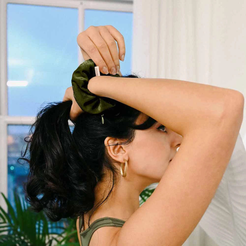 Velvet Olive dark green hair scrunchie ponytail holder featuring a hidden zipper pocket for storing valuables (cash, keys, AirPods) and strong elastic for a secure hold. Perfect for workouts, festivals, gifts, and holiday stocking stuffers.