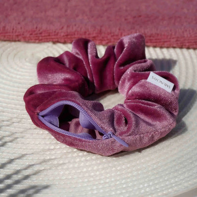 Velvet Purple and pink orchid plum hair scrunchie ponytail holder featuring a hidden zipper pocket for storing valuables (cash, keys, AirPods) and strong elastic for a secure hold. Perfect for workouts, festivals, gifts, and holiday stocking stuffers.