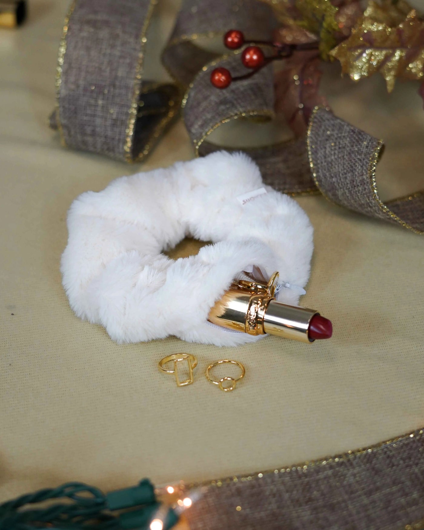 White faux fur holiday scrunchie with hidden zipper pocket for valuables (cash, keys, AirPods), featuring strong elastic for a secure hold. Inspired by the Christmas and winter season, perfect for workouts, festivals, holiday events, and stocking stuffers. 