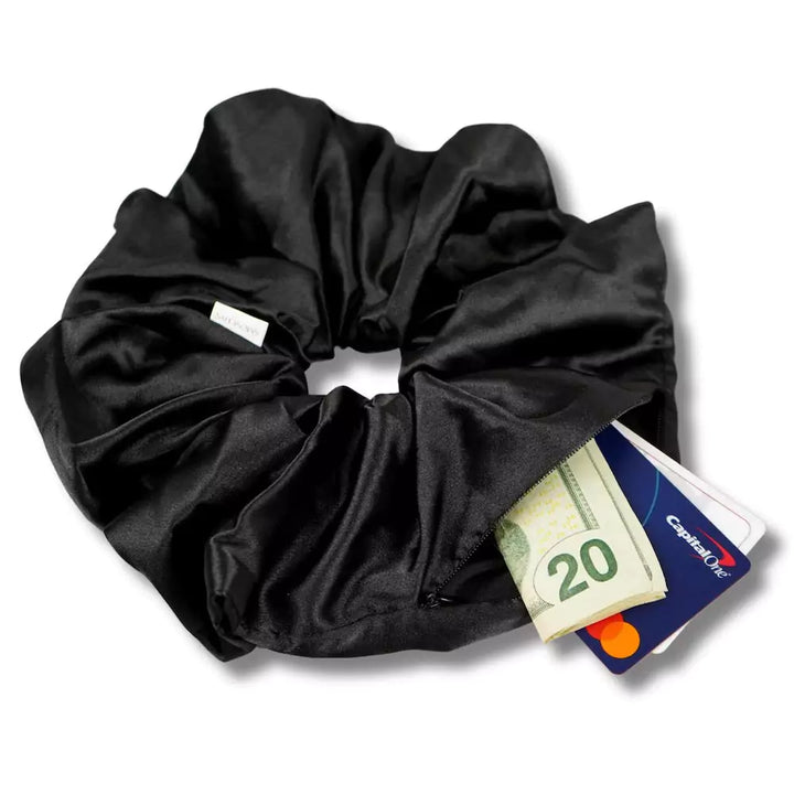 Satin black jumbo oversized hair scrunchie with hidden zipper pocket for valuables (cash, cards, keys, AirPods), strong elastic for secure hold, perfect for workouts, festivals, gifts, and holiday stocking stuffers. Oversized scrunchie ideal for thick hair and ponytails.