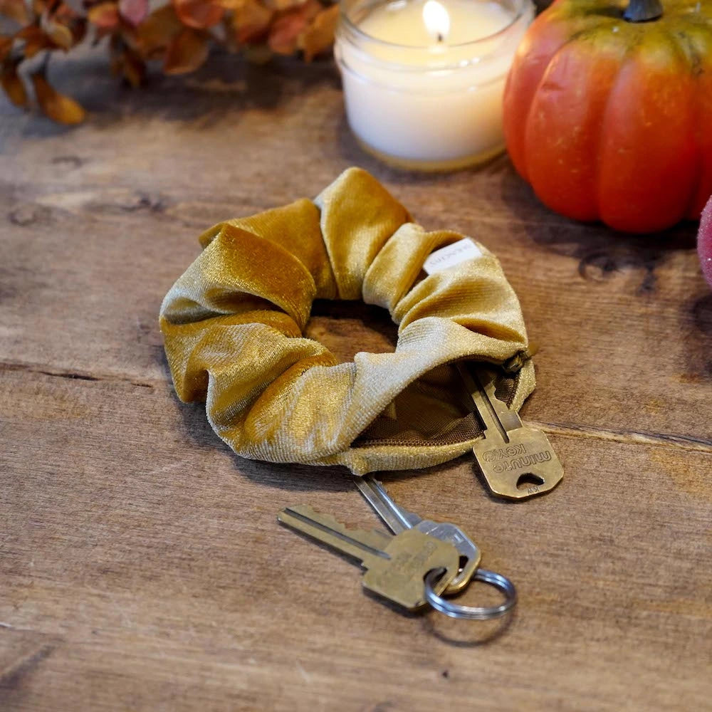 Velvet mustard gold butterscotch scrunchie with hidden zipper pocket for valuables (cash, keys, AirPods), featuring strong elastic for a secure hold, inspired by Halloween and the fall season, perfect for workouts and festivals.