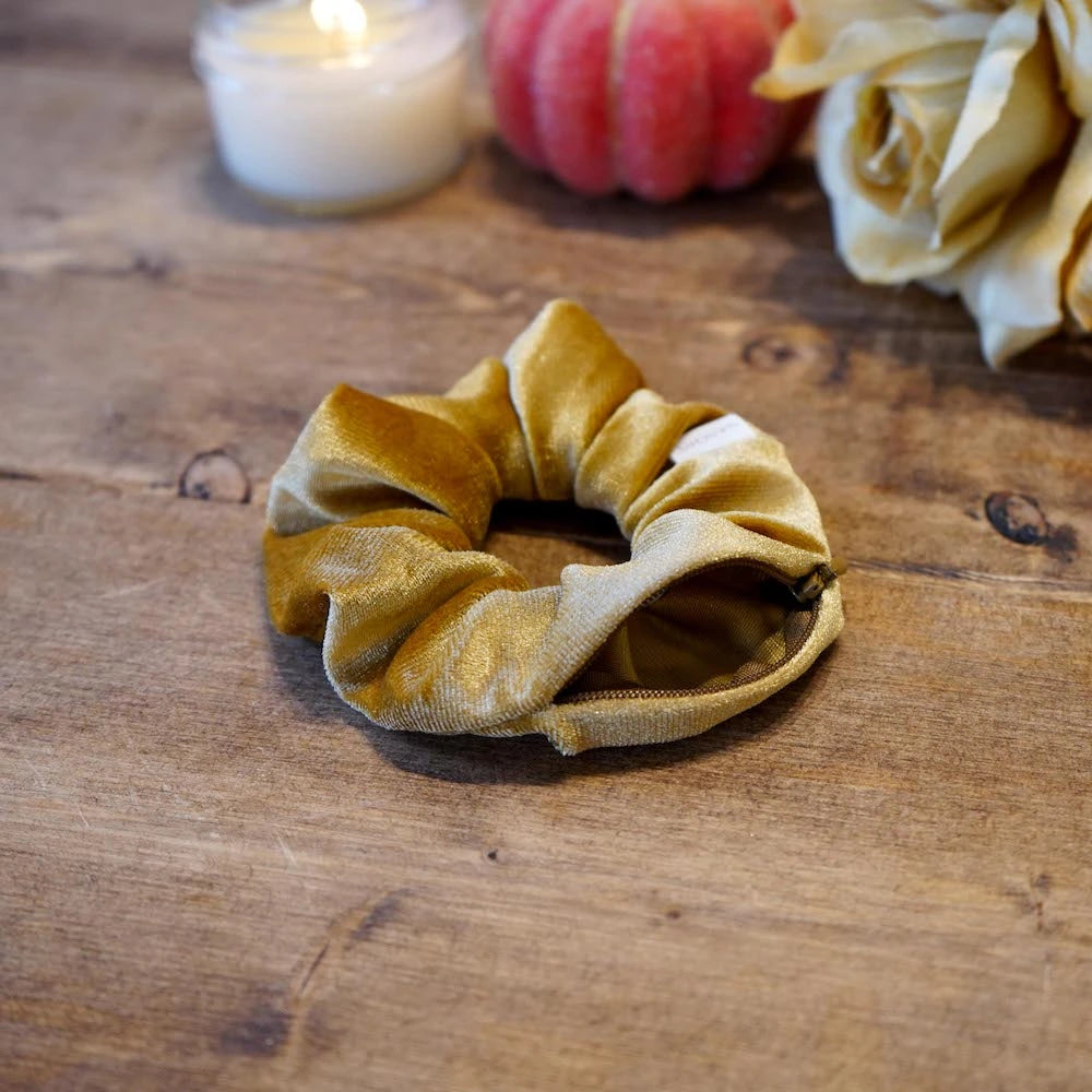 Velvet mustard gold butterscotch scrunchie with hidden zipper pocket for valuables (cash, keys, AirPods), featuring strong elastic for a secure hold, inspired by Halloween and the fall season, perfect for workouts and festivals.