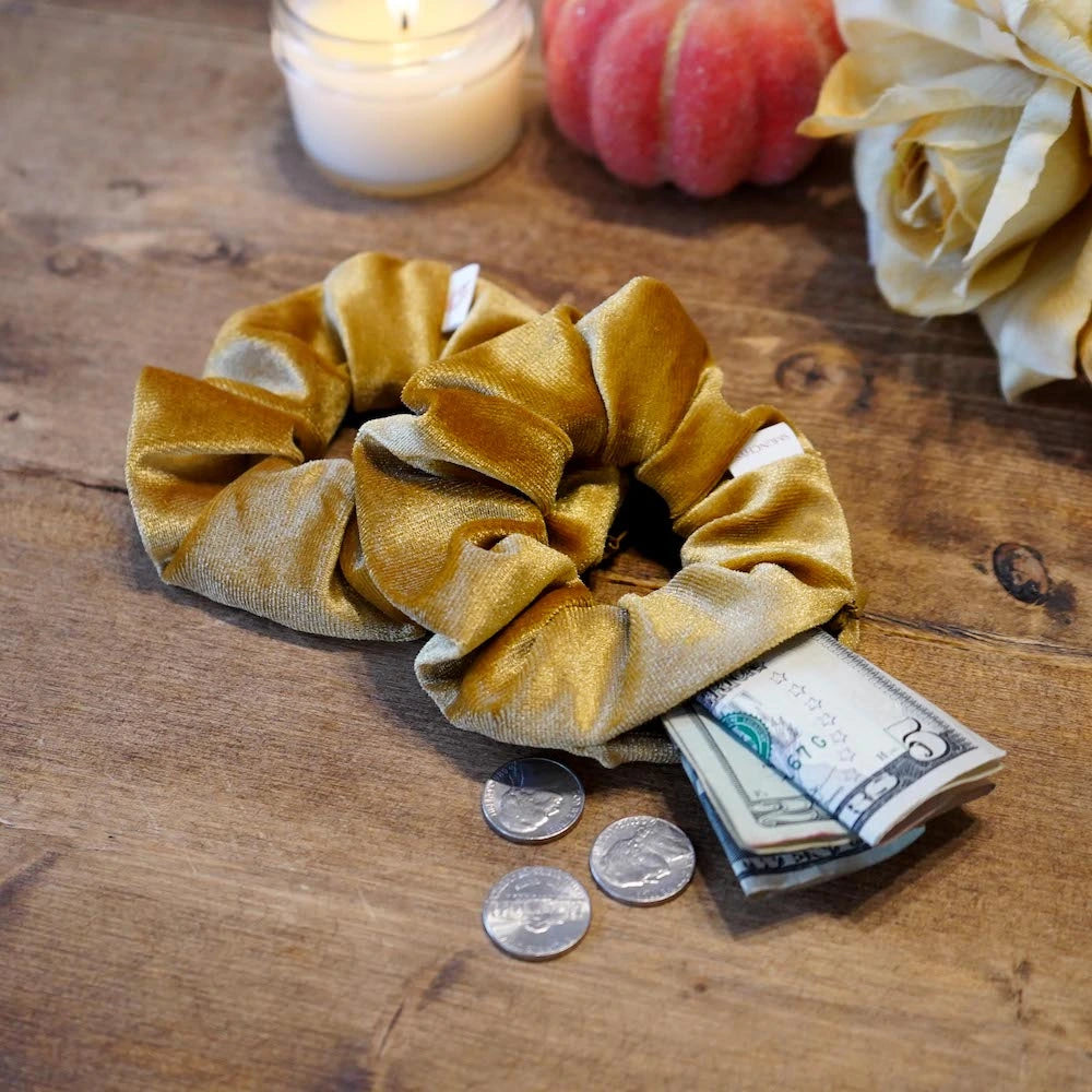 Velvet mustard gold butterscotch scrunchie with hidden zipper pocket for valuables (cash, keys, AirPods), featuring strong elastic for a secure hold, inspired by Halloween and the fall season, perfect for workouts and festivals.